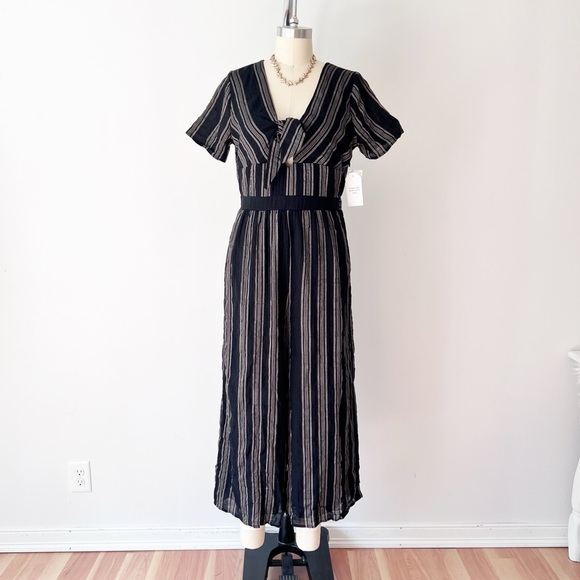 Sadie & Sage Black and Cream Jumpsuit with Peekaboo Detail and Front Tie Striped - Picture 2 of 7